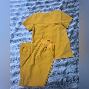 Honey colored scrubs. Small top and medium jogger pants
